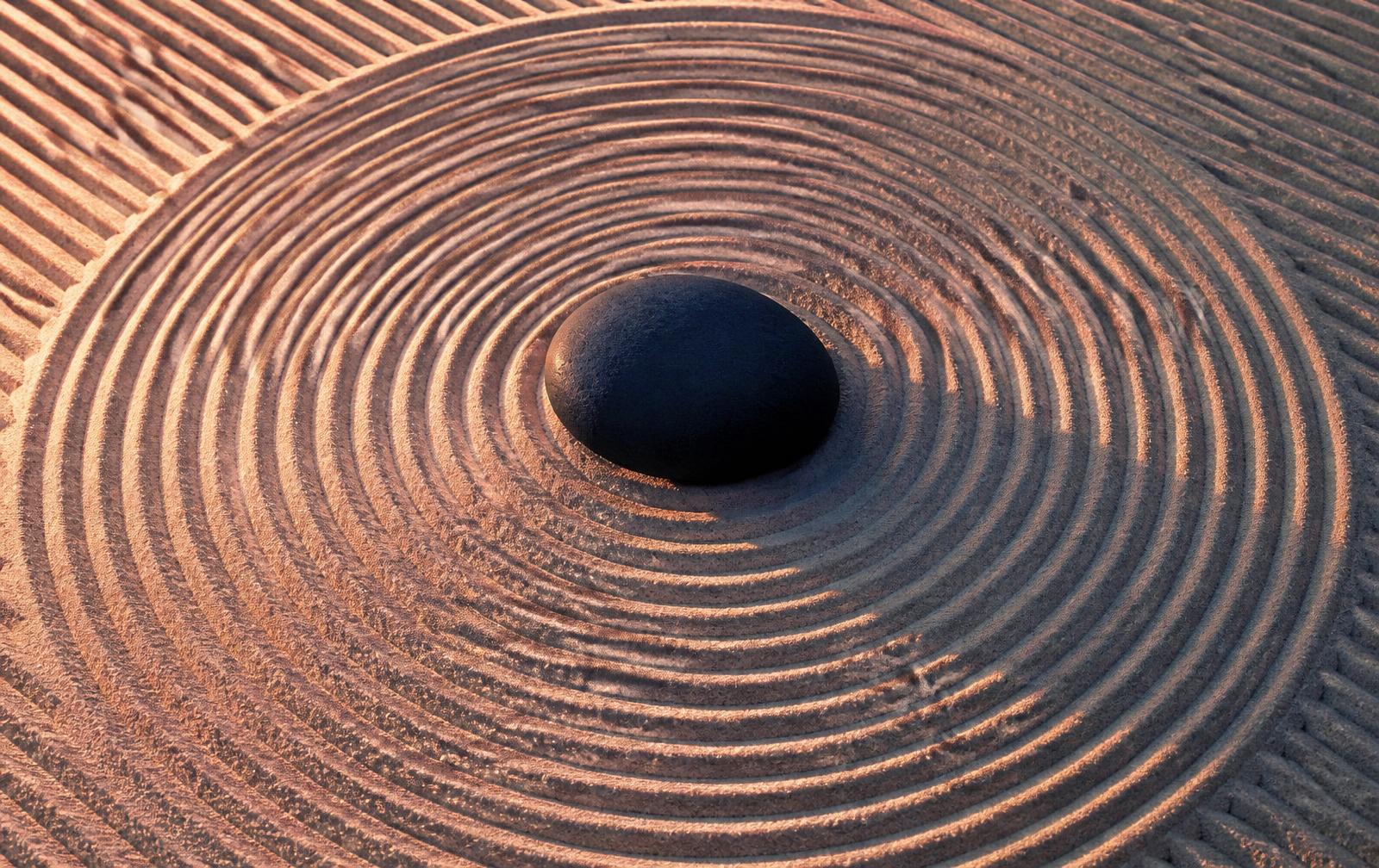 Concentric circles raked into the sand of a Japanese zen garden — an image of disciplined repetition that shapes form.